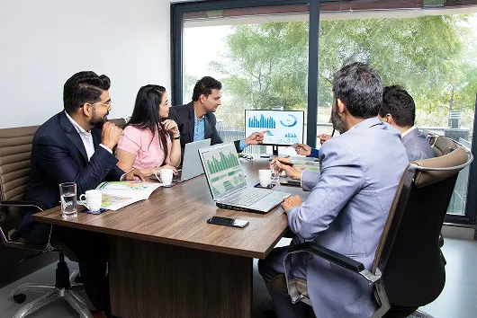Zenex team meeting showcasing collaborative work culture